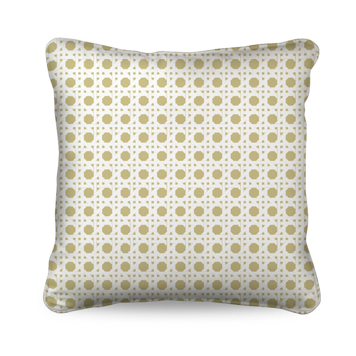 The Wicker Cushion in rattan and white reflects the enduring appeal of tropical revival, with an intricate cane pattern that creates a timeless decorative statement.