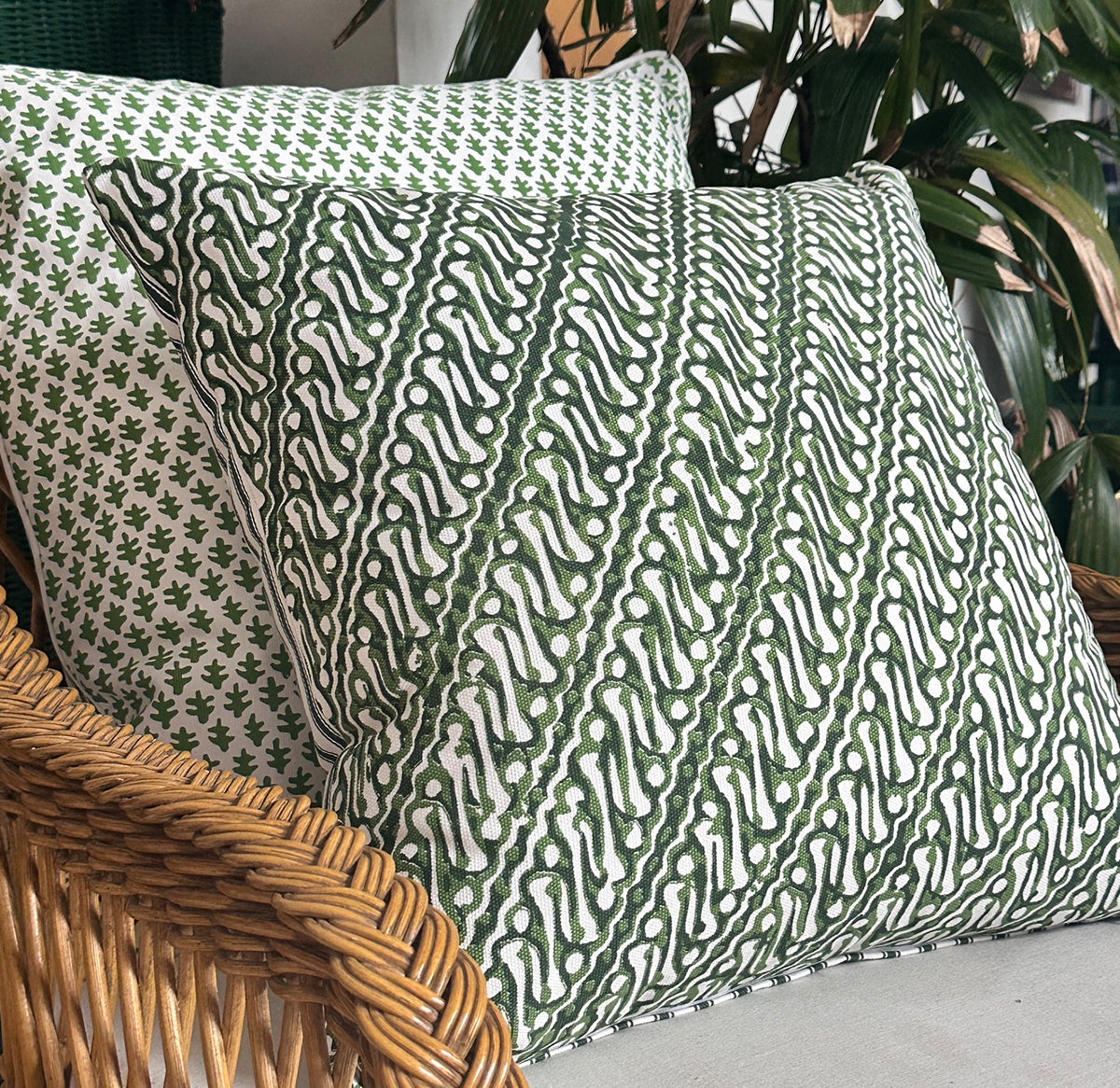 Infuse your space with the artisanal beauty of the Jawa Cushion. Features a parrot green batik design on lightweight canvas. Discover yours now!